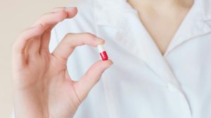 doctor holding a pill