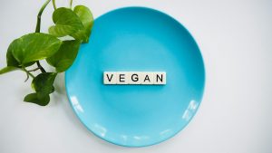 the word vegan on a plate represents vegan weight loss supplements